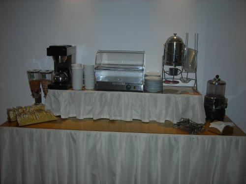 a table with a white table cloth on it at Hotel Agli Artisti in Venice