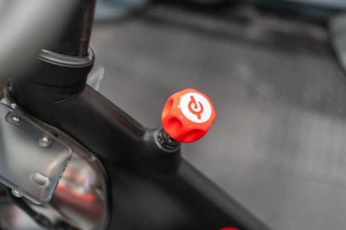a red button on the handlebars of a bike at Sonesta Essential Vacaville Napa Valley in Vacaville