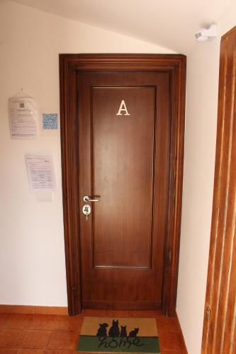 a door with aaa on it in a room at Casa Trevisan in Marco Simone