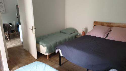 Katil atau katil-katil dalam bilik di Appartement 80m2 6 couchages