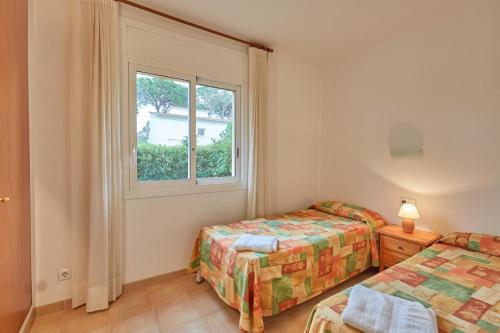 Postel nebo postele na pokoji v ubytování Apartaments Sa Guilla