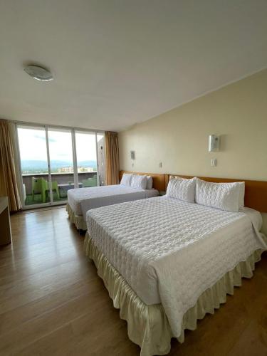 Ένα ή περισσότερα κρεβάτια σε δωμάτιο στο Hotel La Estancia