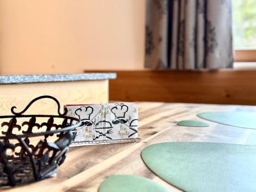a table with a basket on top of a table at Brunnwirt ESSEN & WOHNEN in Fuschl am See