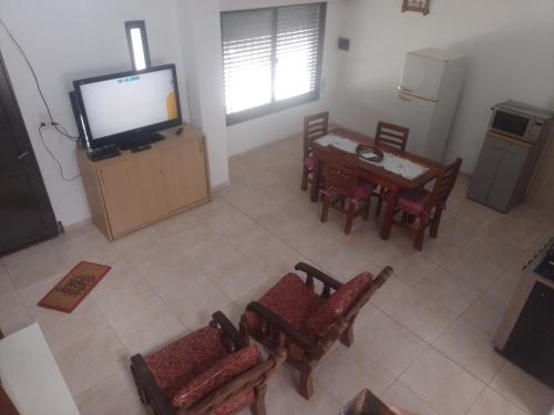an overhead view of a living room with a television and a table at Don Jose in Piquete