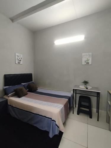 a bedroom with a bed and a small table at LFA House in San Lorenzo