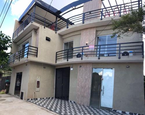 a building with balconies and a balcony on it at LFA House in San Lorenzo