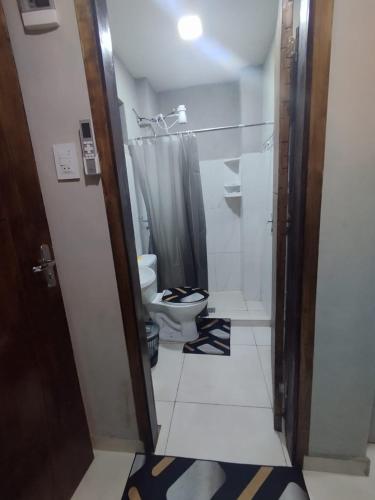 a bathroom with a toilet and a shower at LFA House in San Lorenzo