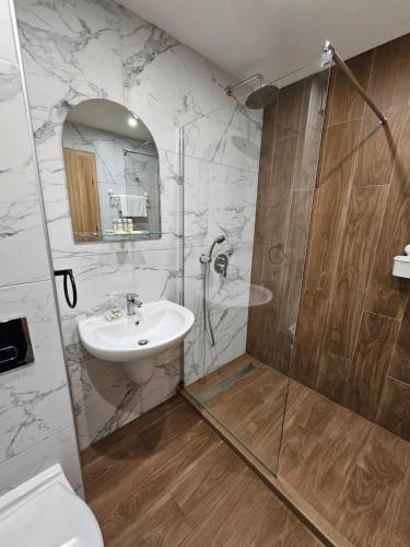 a bathroom with a sink and a shower at BoroHome in Borovets