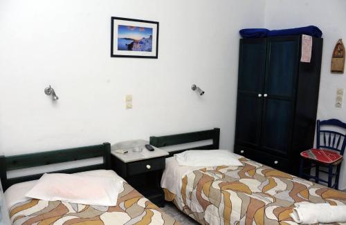 Postel nebo postele na pokoji v ubytování Rooms Mike Paros