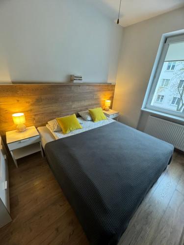 Posteľ alebo postele v izbe v ubytovaní Apartament Akali Centrum -Parking
