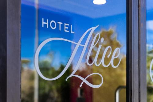 a hotel life sign in a window of a hotel at Hotel Alice in Atlantic Beach