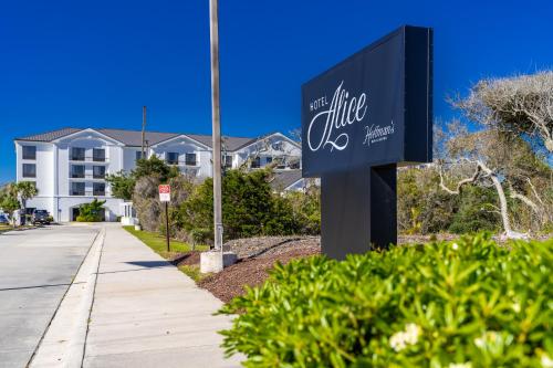 a sign in front of a building at Hotel Alice in Atlantic Beach