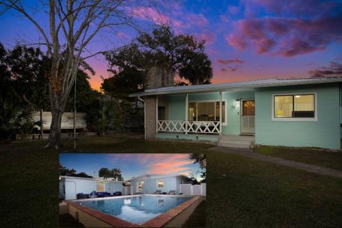 a house with a swimming pool in front of it at Family House, heated pool in St. Augustine