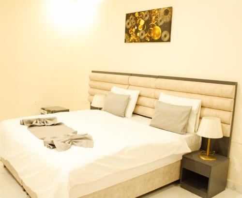 Postel nebo postele na pokoji v ubytování Urban Hotel Suites