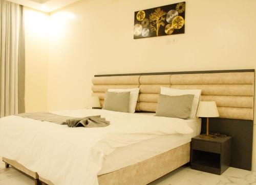 Postel nebo postele na pokoji v ubytování Urban Hotel Suites