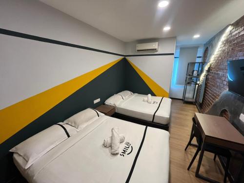 Кровать или кровати в номере Seeds Hotel Klang Bayu Perdana