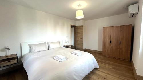 Postel nebo postele na pokoji v ubytování Appartement Moderne et Spacieux, à 10 min de la Gare