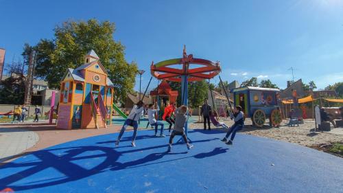 a group of children playing in a playground at Z8 Prémium Apartman in Kaposvár