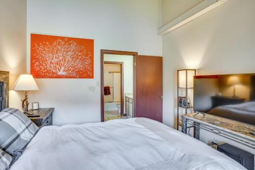 a bedroom with a large white bed in a room at Ski-InandSki-Out Brian Head Condo with Hot Tub! in Brian Head