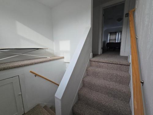 a stairway in a room with a stair case at Private rooms in Rochester home- Near Hospitals and Universities in Rochester