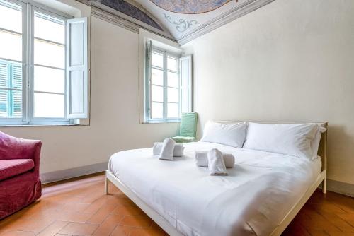 Ένα ή περισσότερα κρεβάτια σε δωμάτιο στο Hostly-Maison Le Vettovaglie-Historical Center