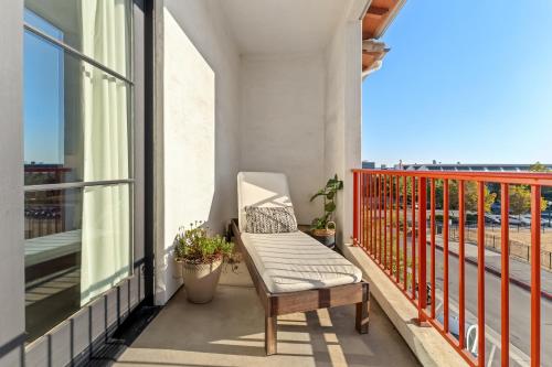 a chair on a balcony with a view at Hotel Casa 425 + Lounge, A Four Sisters Inn in Claremont