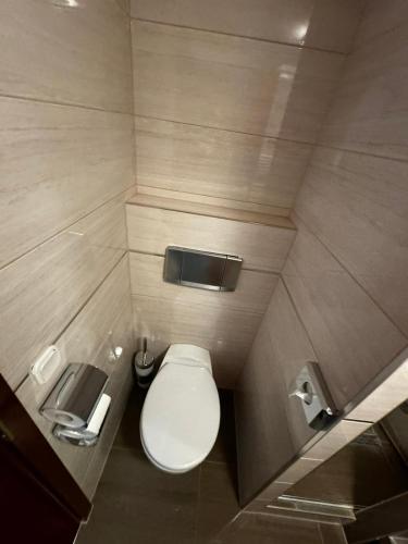 a small bathroom with a toilet and a sink at S und B Apartments Weingarten in Weingarten