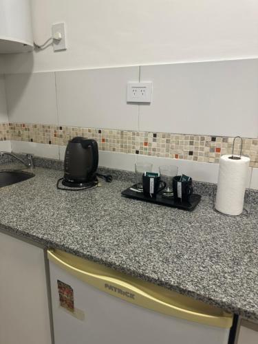 a kitchen counter with two coffee cups on it at Lo de Hugo in Muñiz