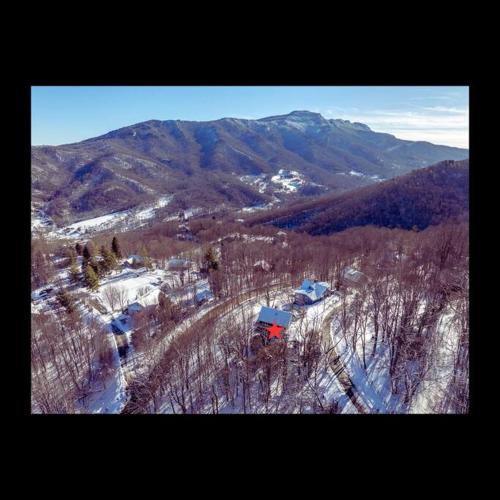 an aerial view of a mountain with snow and trees at 1MMView-2Kings-HotTub-PoolTable-Arcade-Waterfall in Seven Devils