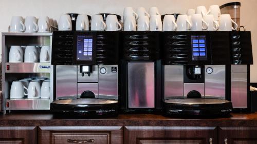a group of three microwaves sitting on top of a counter at Westlands of Pitlochry in Pitlochry
