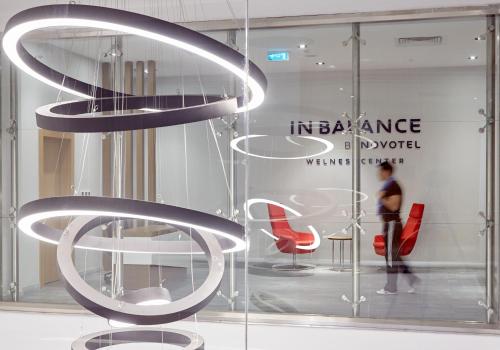 a glass display case with chairs in a store at Novotel Konya in Konya
