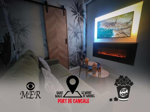 カンカルにあるMRODBNB - Appart Neuf - Aperçu Mer - 25m Plage & Resto - Ciné - Cheminée - Popcornのリビングルーム(テレビ、暖炉付)