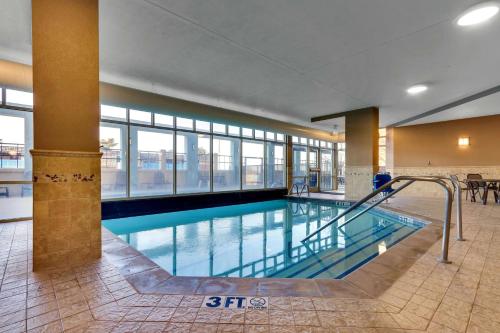 a large swimming pool in a large building at Drury Inn & Suites Sikeston in Sikeston