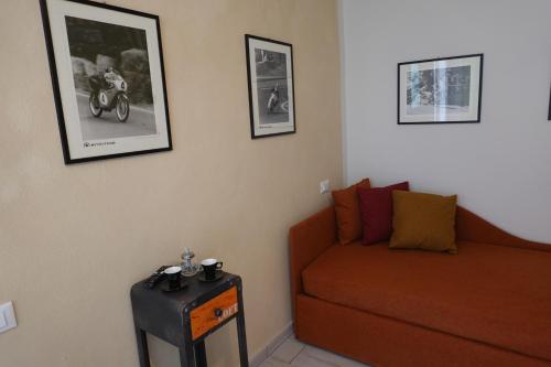a living room with a couch and a table at La Foresteria della Beppa in Zeri