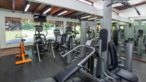 a gym with cardio equipment and treadmills at Holiday Inn Cuernavaca by IHG in Cuernavaca