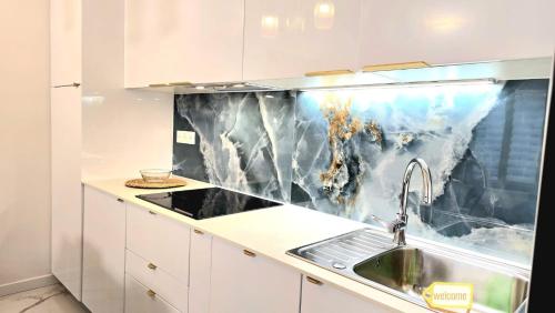 a kitchen with a sink and a counter top at Temple Marais 1 in Paris