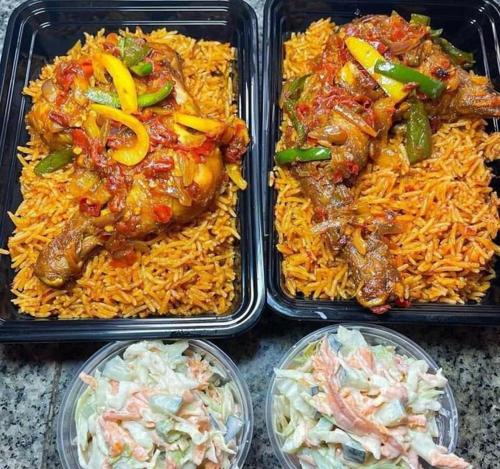 four plastic containers filled with rice and chicken and vegetables at Hotel De Alommah Kubwa Abuja in Abuja