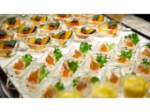 a buffet filled with small plastic cups of food at Blanchette Nankishirahama - Vacation STAY 05732v in Kanayama