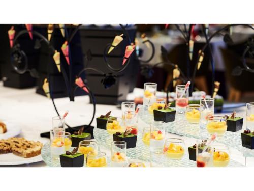 a table topped with glasses of drinks and desserts at Blanchette Nankishirahama - Vacation STAY 05733v in Kanayama