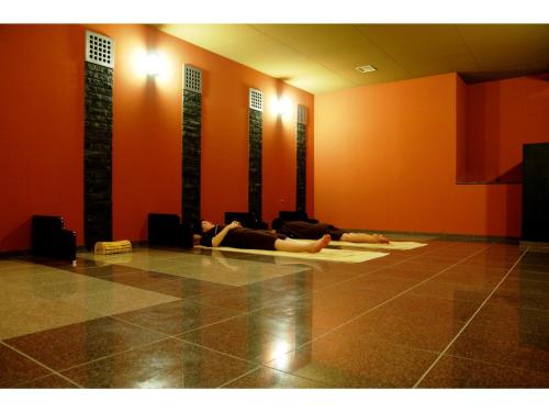 a person laying on the floor in a room at Tokigasane - Vacation STAY 21018v in Kaga