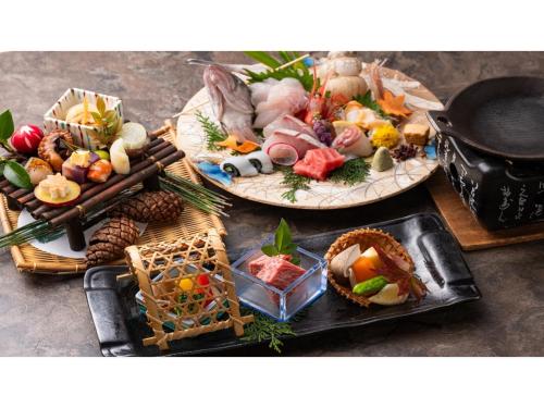 a table with three plates of food on it at Tokigasane - Vacation STAY 21018v in Kaga