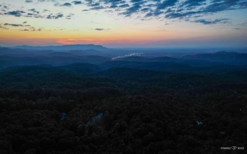 an aerial view of a forest at sunset at Halfway to Heaven in Sevierville