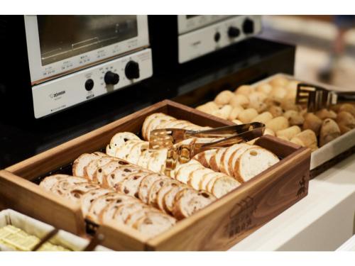 a tray of different types of bread in a bakery at Blanchette Nankishirahama - Vacation STAY 05733v in Kanayama
