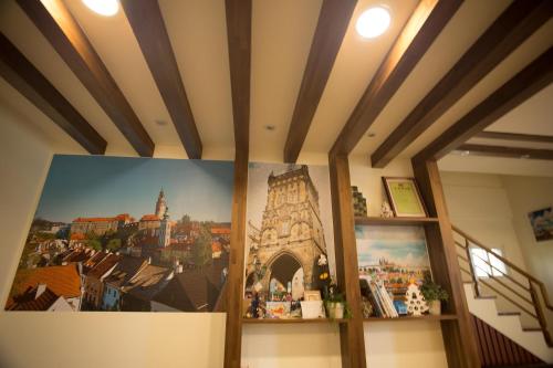 a room with a poster of a city on the wall at 輕旅小站 Soft Travel Hostel in Taitung City