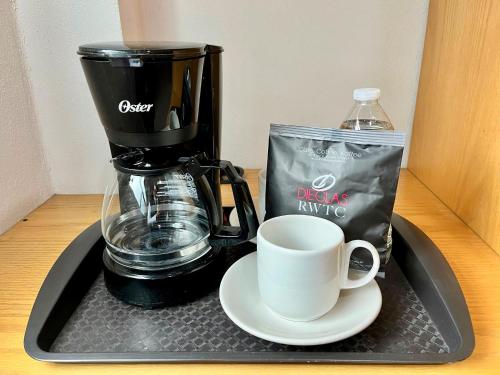 a coffee maker and a cup on a tray at Hotel Posada Maria Sofia in Cholula