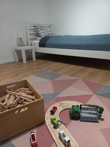 a bedroom with a bed and a toy truck and a toy truckestamp at Dunakorzo Apartman in Szentendre