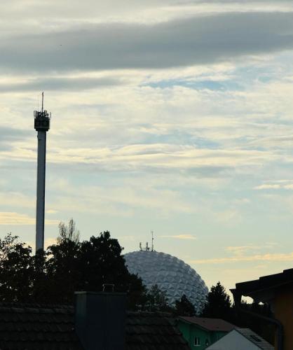 a control tower in the distance with a sky at Apartment Julian in Rust