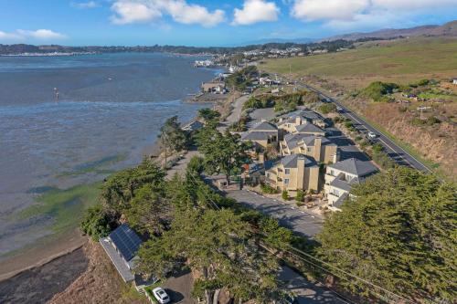 an aerial view of a row of houses next to the water at Bodega Coast Inn and Suites in Bodega Bay