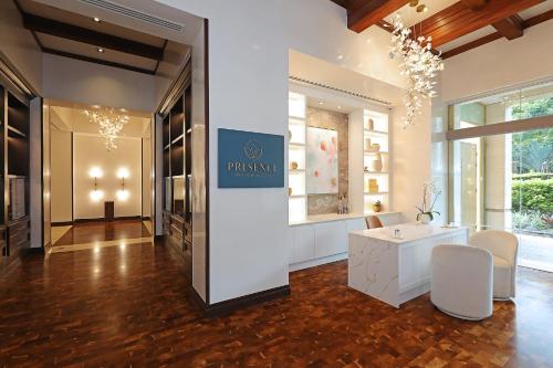 a fashion store with a chandelier in a room at InterContinental Costa Rica at Multiplaza Mall by IHG in San José