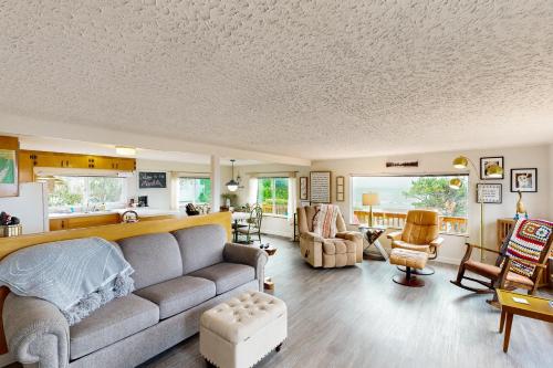 a living room with a couch and a table at Whale Watch in Lincoln City